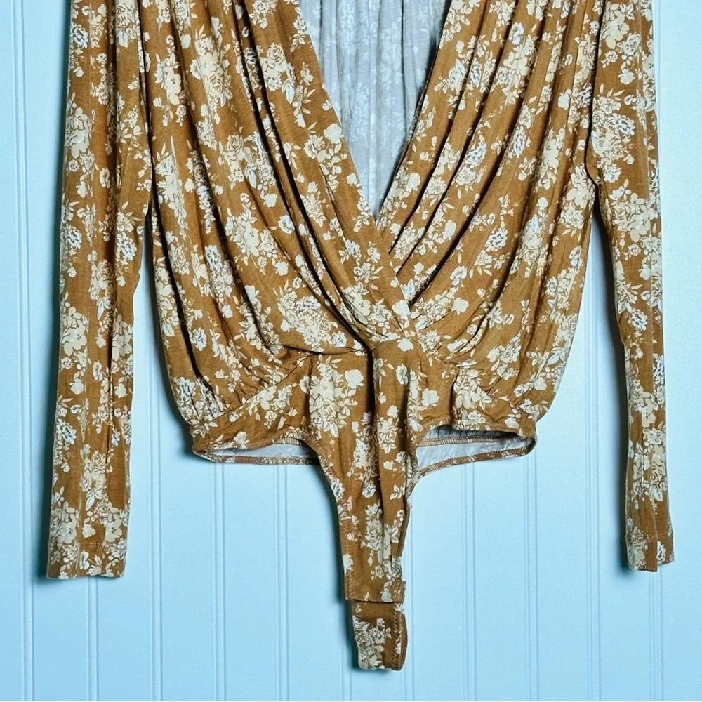 FREE PEOPLE Turnt Surplice Bodysuit in a copper floral print Medium NWT - Picture 7 of 11